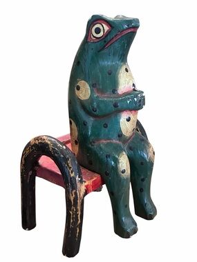 Wooden carved folk art frog on bench 9”